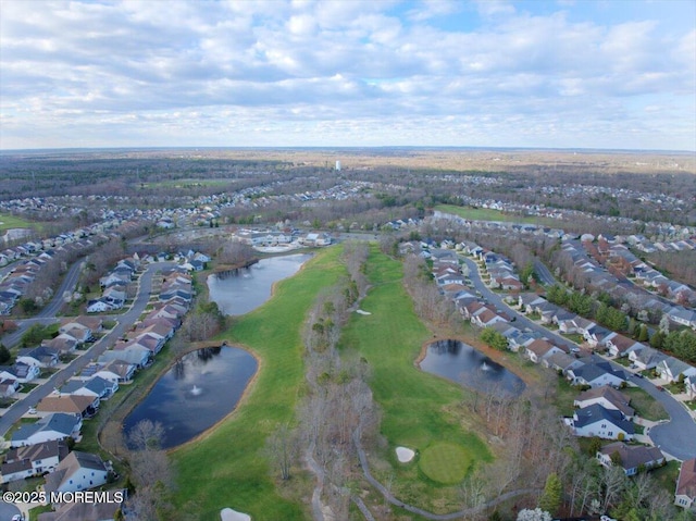 drone / aerial view featuring a water view and a residential view