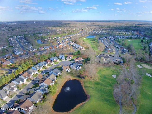 bird's eye view featuring a water view and a residential view