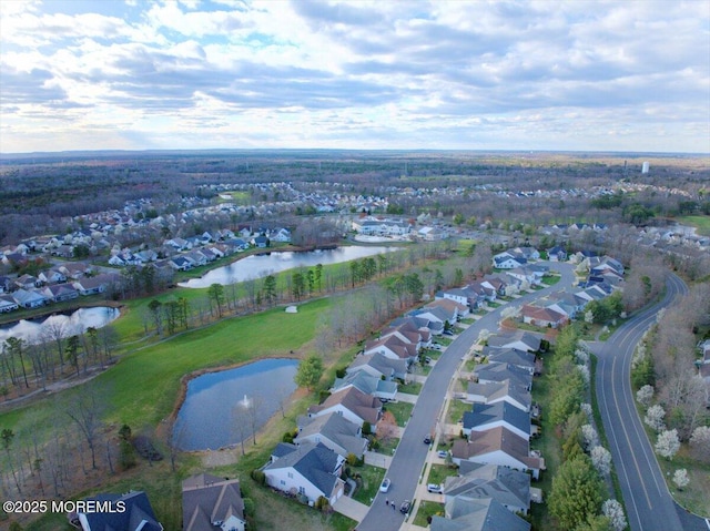 birds eye view of property with a residential view and a water view