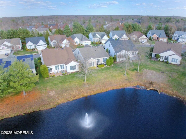 bird's eye view featuring a residential view and a water view