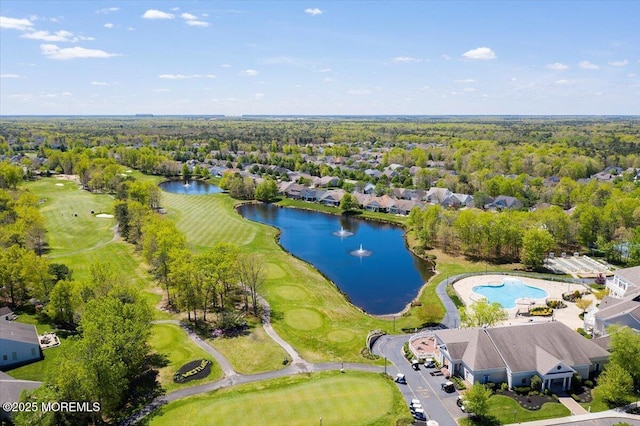 drone / aerial view with view of golf course and a water view