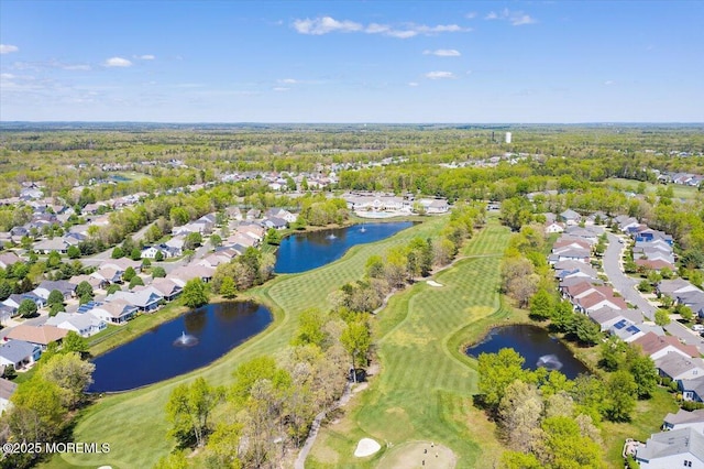 birds eye view of property featuring a water view, a residential view, and view of golf course