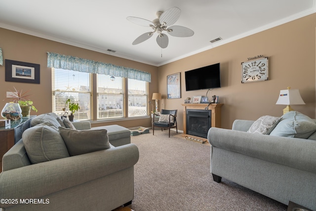 33 Blue Heron Ln, Bayville, NJ 08721 - living room featuring ornamental molding, carpet flooring, a ceiling fan, and a fireplace with flush hearth