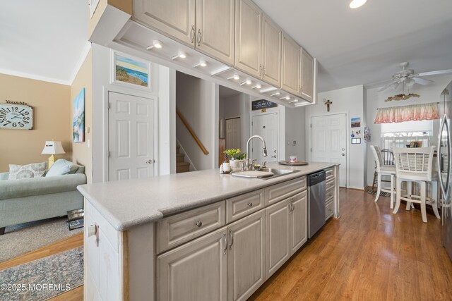 33 Blue Heron Ln, Bayville, NJ 08721 - kitchen featuring dishwasher, ceiling fan, light countertops, open floor plan, and crown molding