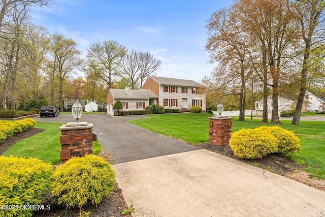 36 New Monmouth Rd, Middletown, NJ 07748 - view of front of home with a front yard and driveway