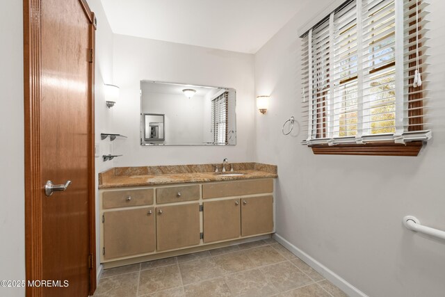 36 New Monmouth Rd, Middletown, NJ 07748 - bathroom with plenty of natural light, baseboards, and vanity