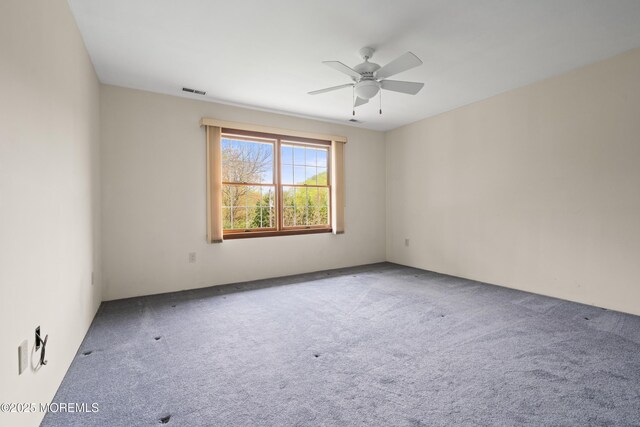 36 New Monmouth Rd, Middletown, NJ 07748 - carpeted empty room featuring ceiling fan