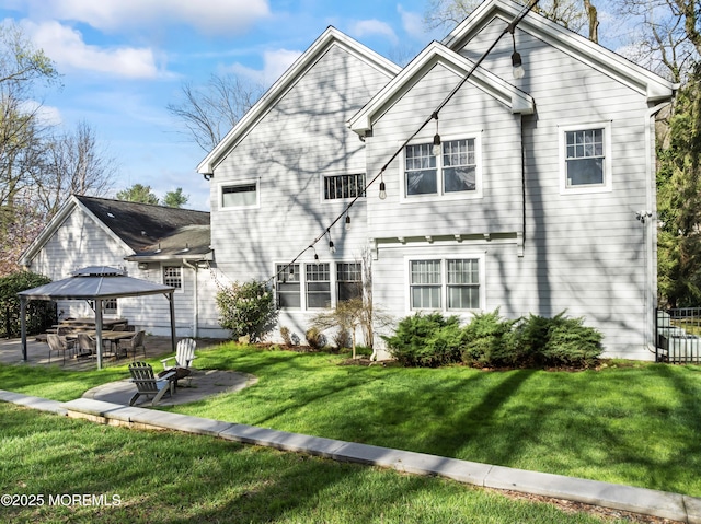 view of front of property featuring a patio area, a front yard, and fence