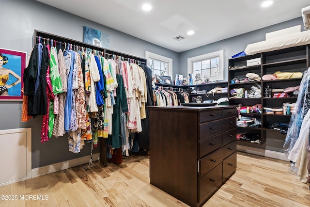 spacious closet with light wood finished floors