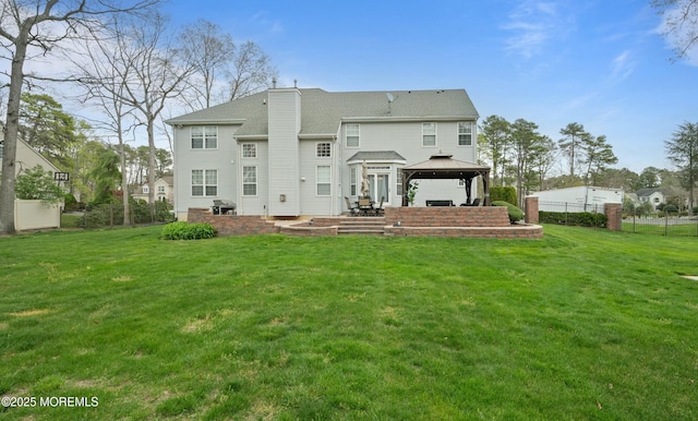 101 Erin Dr, Jackson, NJ 08527 - rear view of house featuring a lawn, a gazebo, a patio area, and a chimney