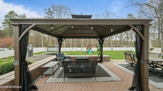 101 Erin Dr, Jackson, NJ 08527 - view of patio featuring a fenced backyard, a playground, a trampoline, outdoor dining space, and an outdoor living space