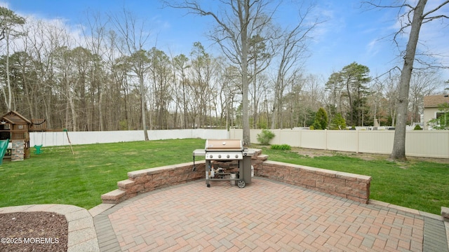101 Erin Dr, Jackson, NJ 08527 - view of patio with a fenced backyard, a grill, and a playground