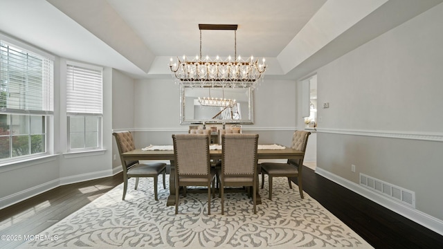 101 Erin Dr, Jackson, NJ 08527 - dining space featuring a tray ceiling, wood finished floors, visible vents, baseboards, and a chandelier