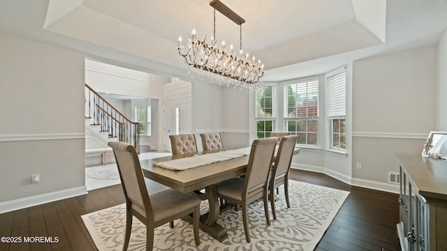 101 Erin Dr, Jackson, NJ 08527 - dining space with a raised ceiling, stairway, baseboards, and dark wood-style floors
