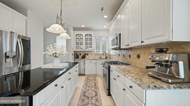 101 Erin Dr, Jackson, NJ 08527 - kitchen with white cabinetry, backsplash, appliances with stainless steel finishes, visible vents, and recessed lighting