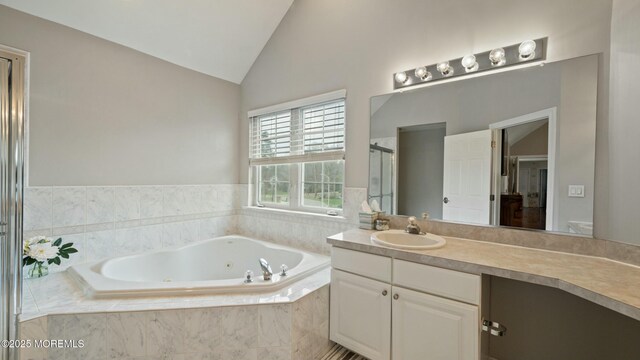 101 Erin Dr, Jackson, NJ 08527 - bathroom with a shower stall, vaulted ceiling, vanity, and a jetted tub