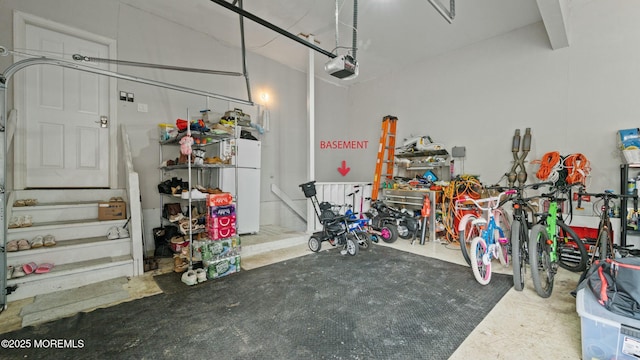 101 Erin Dr, Jackson, NJ 08527 - garage with a garage door opener and freestanding refrigerator