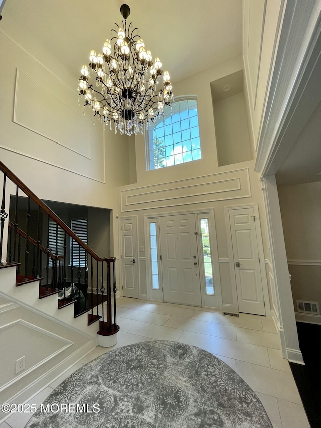 101 Erin Dr, Jackson, NJ 08527 - entryway with tile patterned floors, visible vents, a chandelier, and stairway