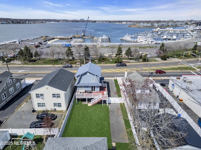 birds eye view of property with a water view