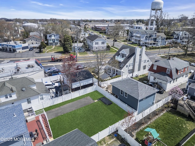 birds eye view of property with a residential view
