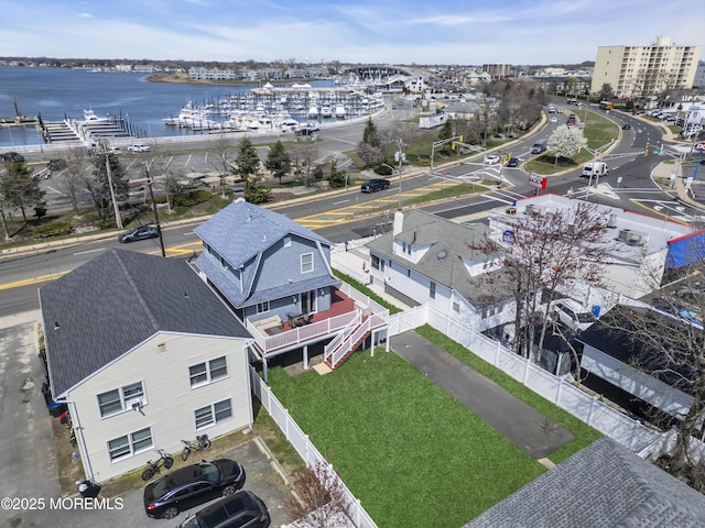 birds eye view of property featuring a water view