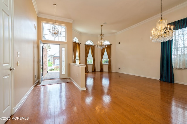 7 Riviera Dr, Monroe, NJ 08831 - foyer entrance with crown molding, wood-type flooring, and a notable chandelier