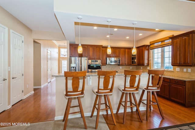 7 Riviera Dr, Monroe, NJ 08831 - kitchen featuring backsplash, appliances with stainless steel finishes, a kitchen bar, and dark wood-style floors