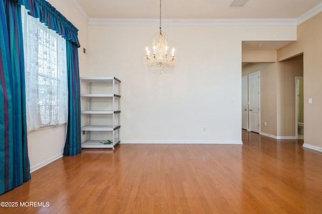 7 Riviera Dr, Monroe, NJ 08831 - empty room with crown molding, a notable chandelier, and wood finished floors