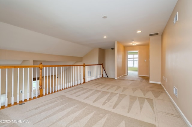 7 Riviera Dr, Monroe, NJ 08831 - bonus room with light colored carpet, baseboards, lofted ceiling, and visible vents