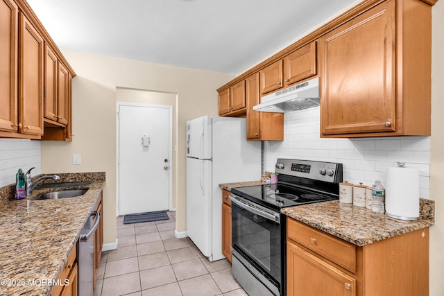 54 Amberly Dr Unit F, Manalapan, NJ 07726 - kitchen featuring light tile patterned floors, brown cabinetry, appliances with stainless steel finishes, under cabinet range hood, and a sink