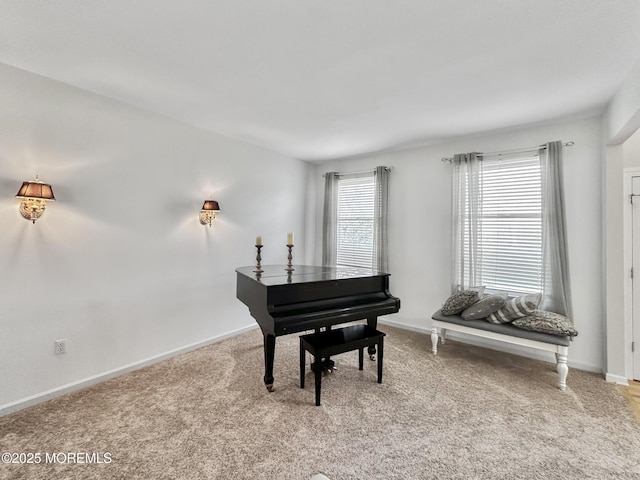 living area with light carpet and baseboards