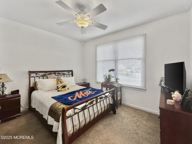 carpeted bedroom featuring baseboards and ceiling fan