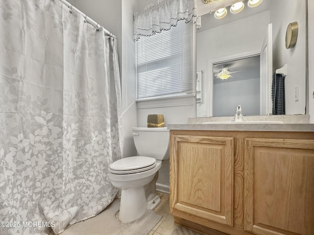 bathroom with ceiling fan, vanity, tile patterned flooring, toilet, and curtained shower