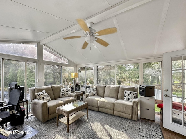 sunroom featuring vaulted ceiling with beams and wood finished floors