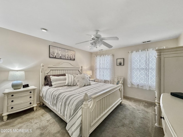 bedroom with carpet, visible vents, baseboards, and a ceiling fan