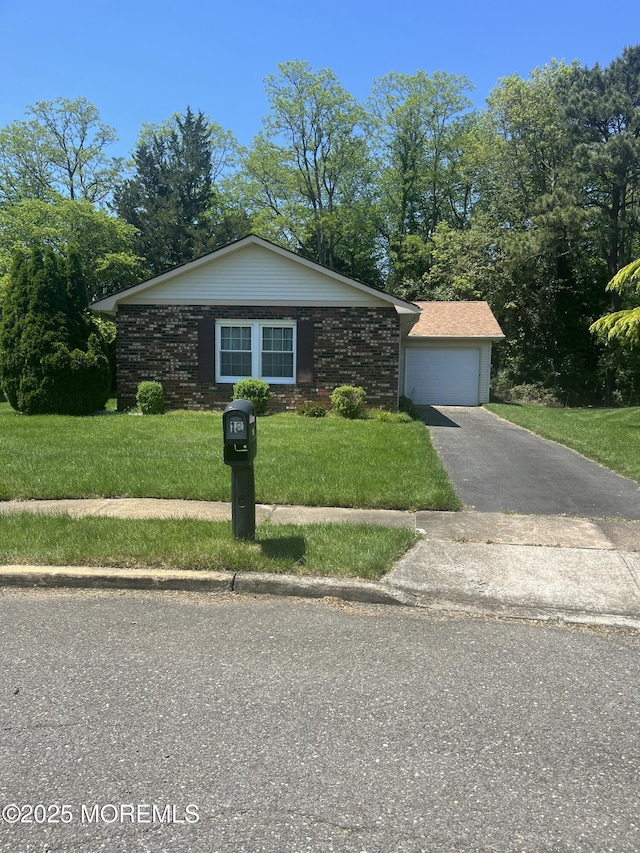 18 Andes Ct, Brick, NJ 08724 - view of front of home with a front lawn, asphalt driveway, and a garage