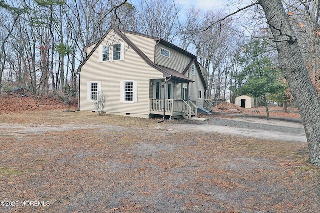 950 Bay Ave, Toms River, NJ 08753 - view of front of property with an outdoor structure, crawl space, and a storage unit