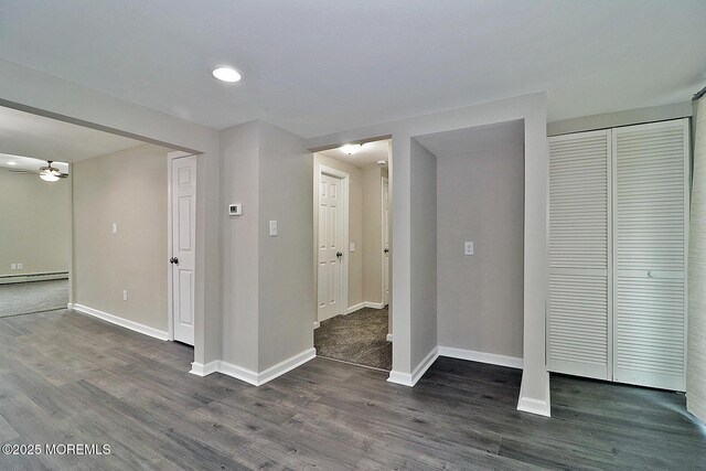950 Bay Ave, Toms River, NJ 08753 - interior space featuring a baseboard heating unit, dark wood-style floors, baseboards, and a ceiling fan