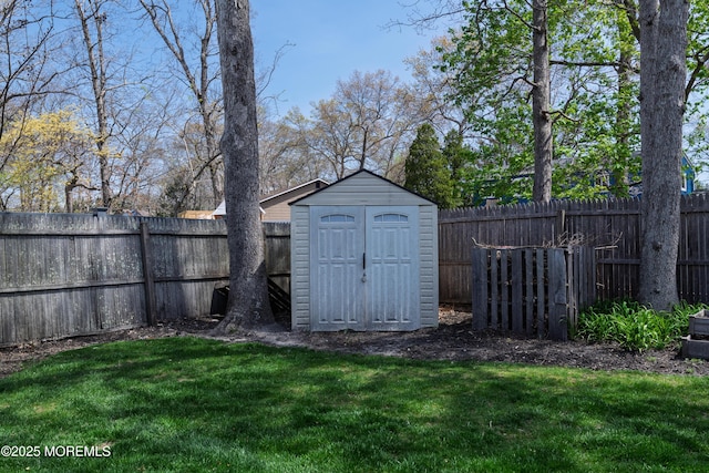 view of shed featuring a fenced backyard