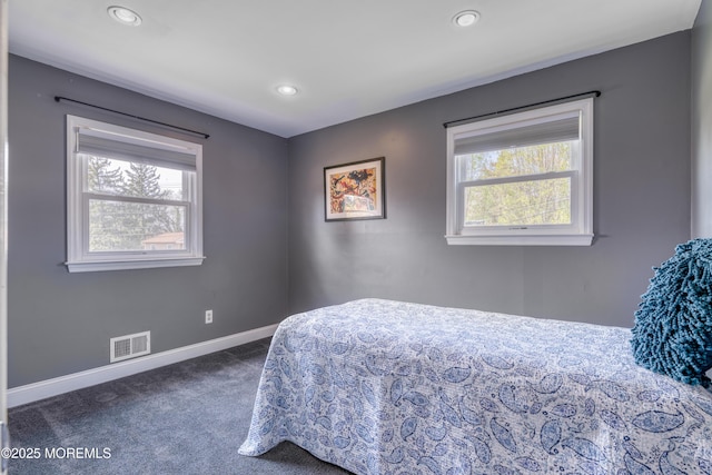 bedroom featuring recessed lighting, dark carpet, visible vents, and baseboards