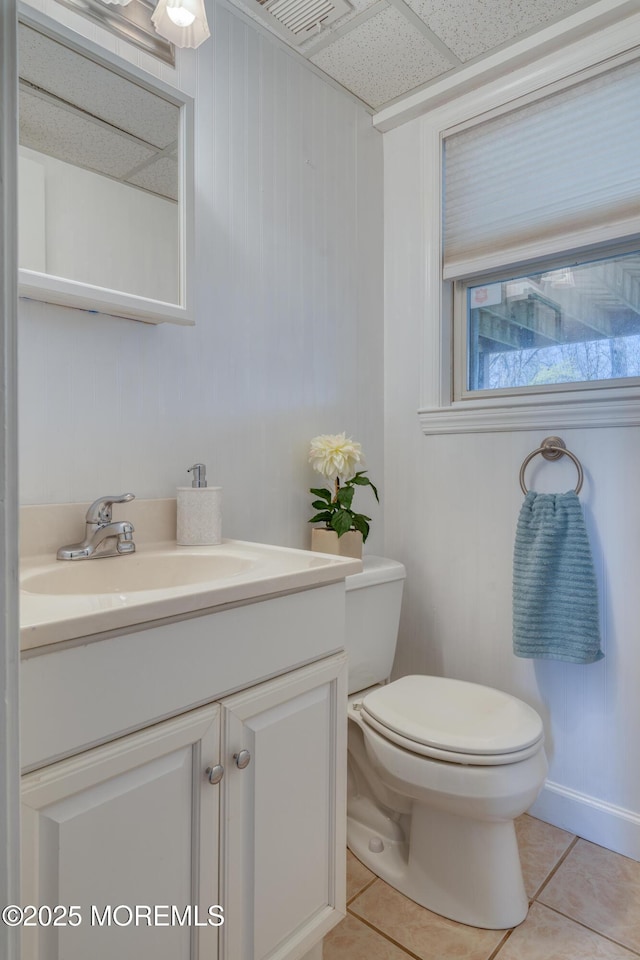 bathroom featuring visible vents, tile patterned floors, vanity, and toilet