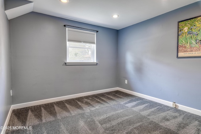 empty room with recessed lighting, baseboards, lofted ceiling, and carpet