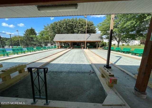view of swimming pool with fence