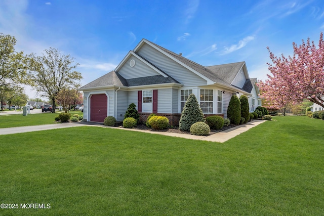 view of front of house with driveway, roof with shingles, a front lawn, and an attached garage