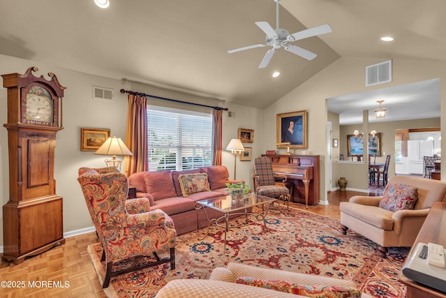 living room with visible vents, ceiling fan, and plenty of natural light
