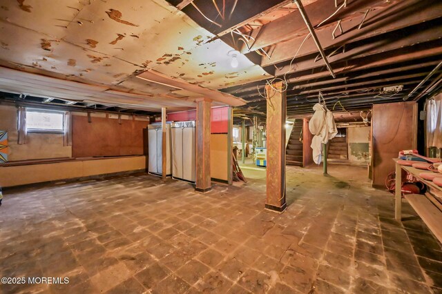 basement featuring stairs