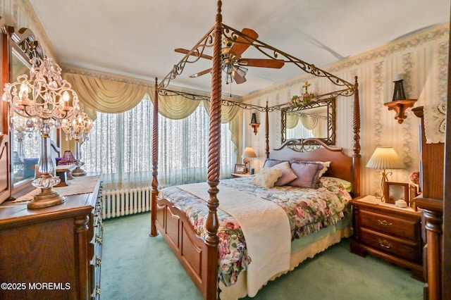 bedroom featuring wallpapered walls, radiator heating unit, multiple windows, and carpet floors