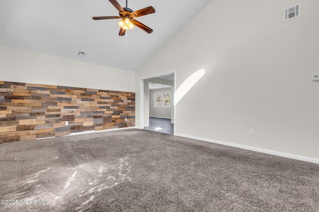 unfurnished living room featuring visible vents, high vaulted ceiling, a ceiling fan, and carpet floors