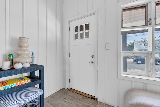 interior space with a decorative wall and light wood finished floors