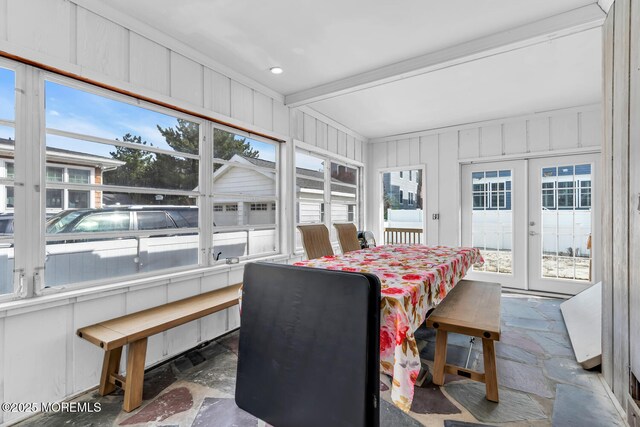 sunroom featuring french doors and beam ceiling